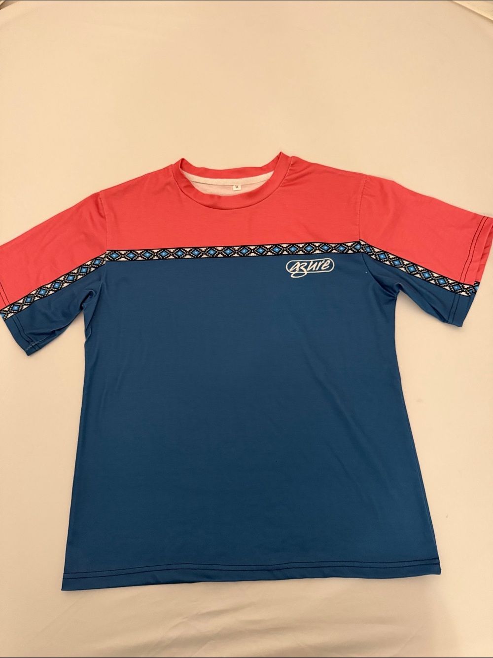 Unbranded blue and pink surf style short sleeve crew neck t-shirt